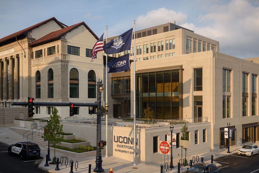 The image shows the facade of UConn Hartford from the corner of Prospect and Arch streets.